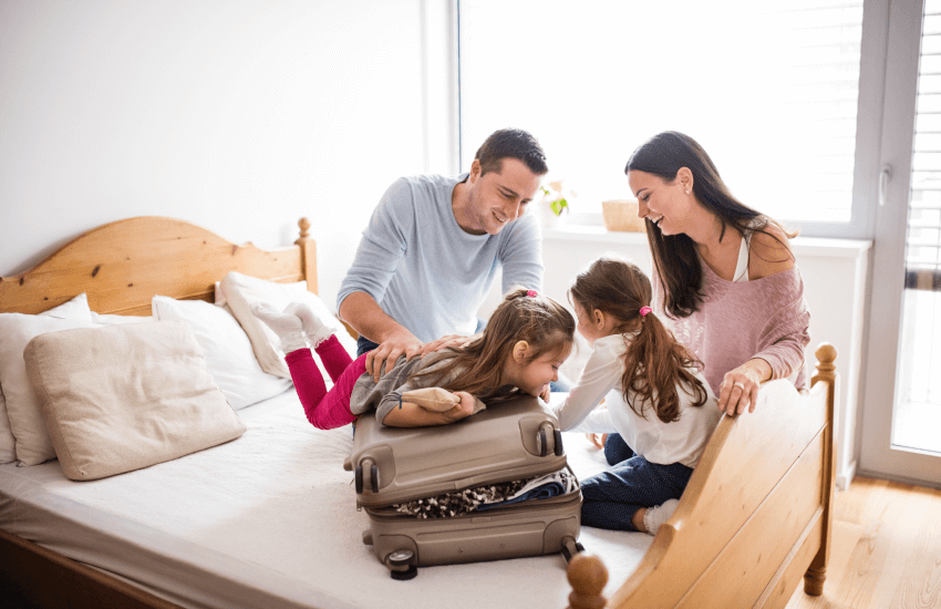 family preparing their travel luggage